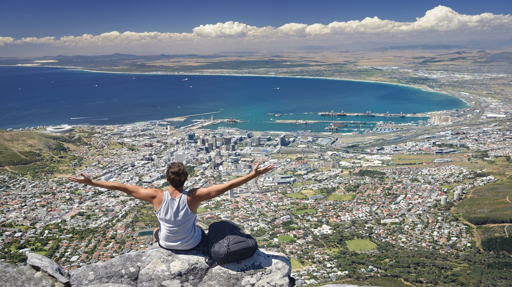 Tourist Hiker on Table Mountain overlooking Cape Town, South Africa
