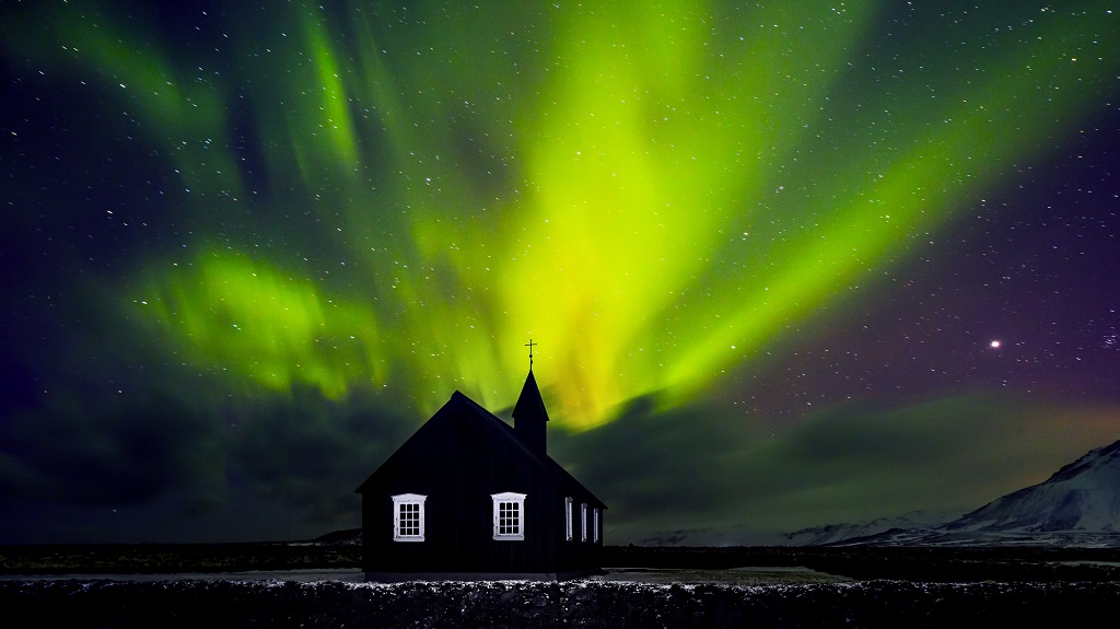 Beautiful Northern light over church Beautiful Northern light over church